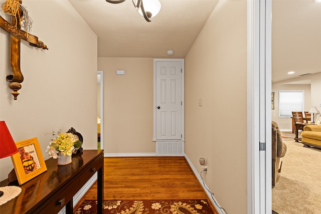 hallway with wood-type flooring