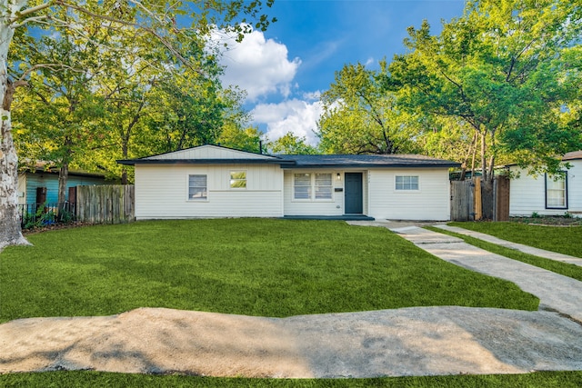 ranch-style house with a front lawn