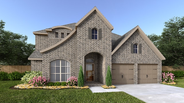 french country style house featuring a front lawn and a garage