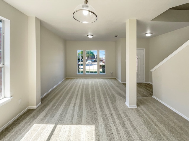 interior space featuring light colored carpet