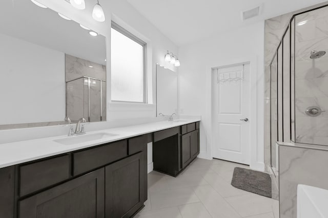 bathroom with vanity, tile patterned floors, and walk in shower