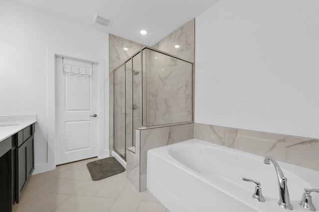 bathroom featuring vanity, tile patterned floors, and independent shower and bath