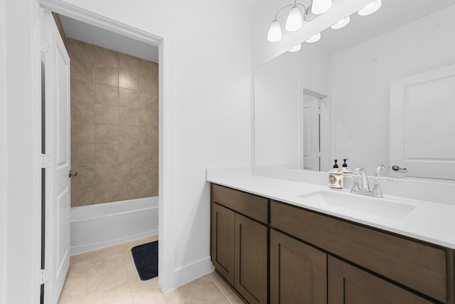 bathroom with vanity, tile patterned floors, and tiled shower / bath