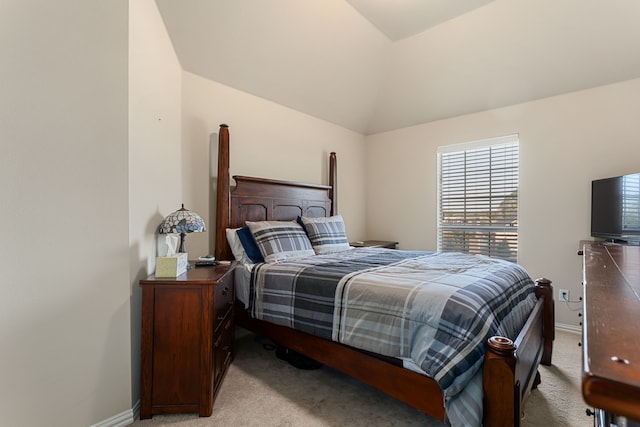 carpeted bedroom with vaulted ceiling