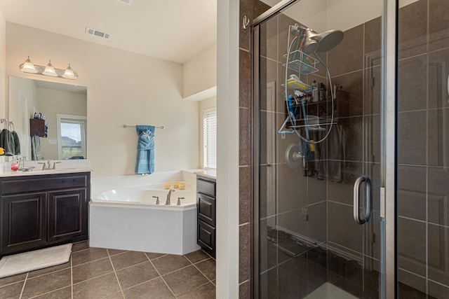 bathroom with vanity, plus walk in shower, and tile patterned floors