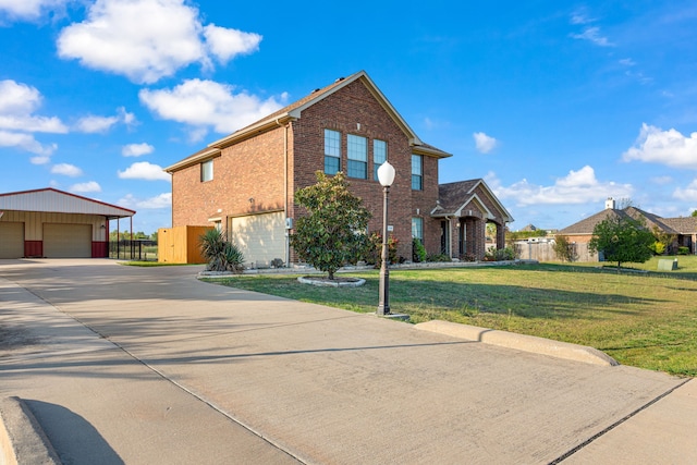 view of front of house with a front yard and a garage