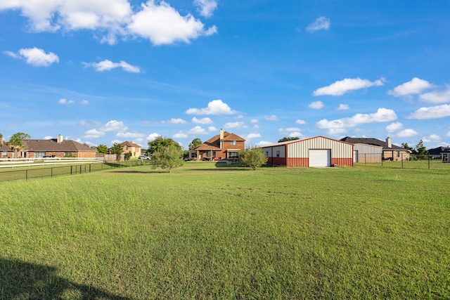 view of yard with an outbuilding and a garage