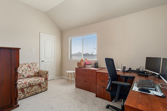 office space with light carpet and lofted ceiling