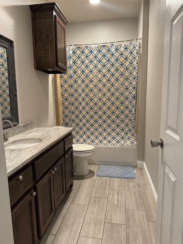 full bathroom featuring vanity, toilet, and shower / bathtub combination with curtain