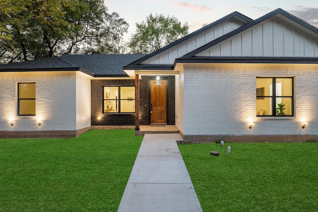 view of front of home with a yard