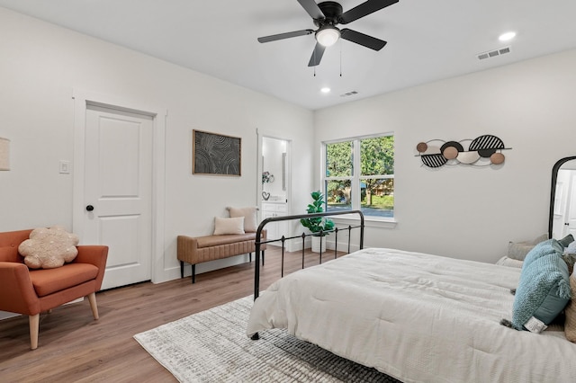 bedroom featuring light wood-type flooring and ceiling fan