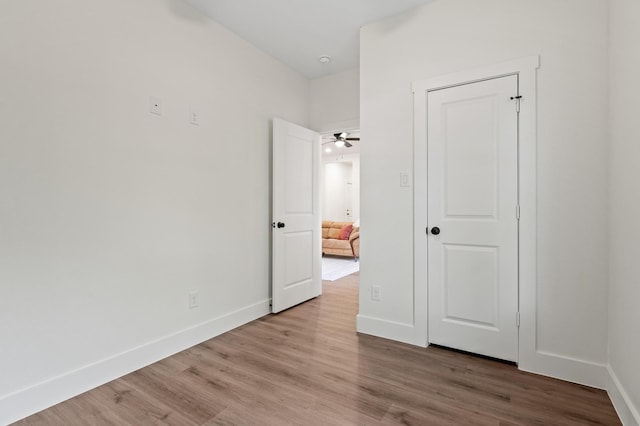 unfurnished bedroom with hardwood / wood-style floors