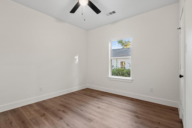 spare room with wood-type flooring and ceiling fan