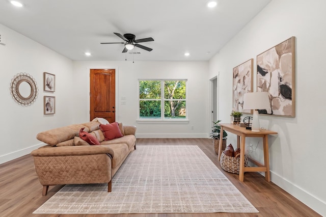 interior space with ceiling fan and light wood-type flooring