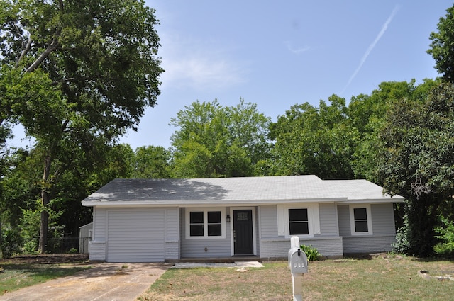 ranch-style home with a front lawn