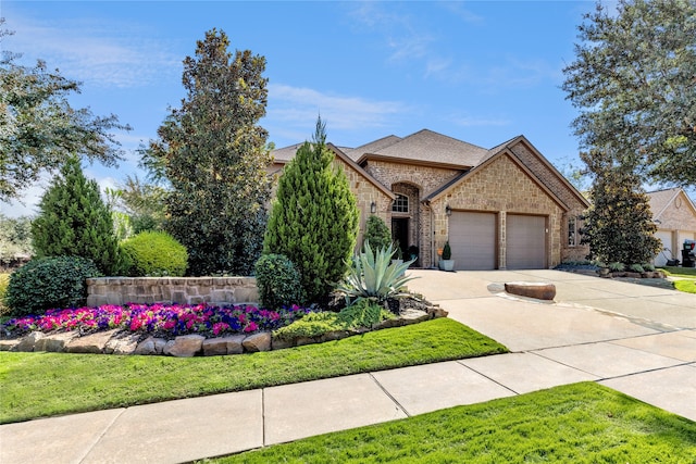 view of front of house with a front lawn and a garage