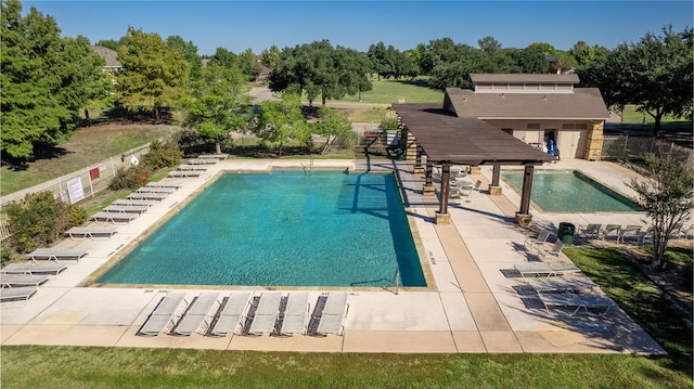 view of swimming pool with a patio