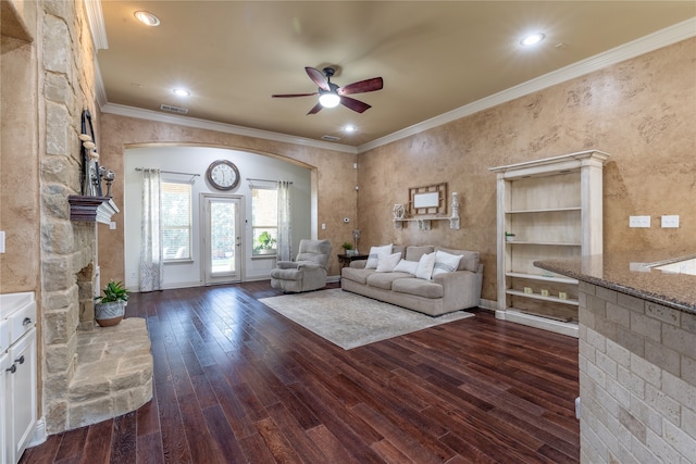 unfurnished living room with ornamental molding, dark hardwood / wood-style floors, and ceiling fan