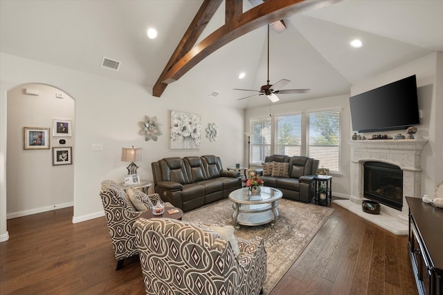 living room with vaulted ceiling with beams, dark hardwood / wood-style floors, and ceiling fan