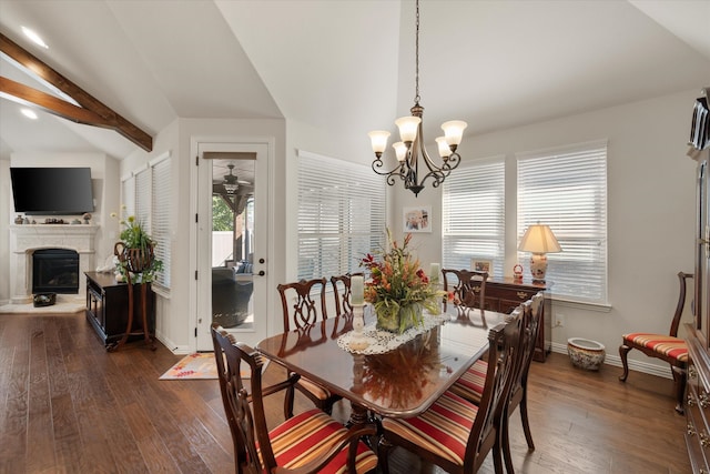 dining space featuring lofted ceiling with beams, a chandelier, and dark wood-type flooring