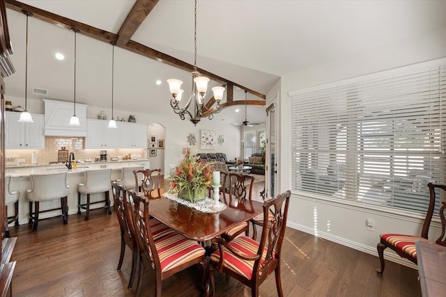 dining room with sink, beam ceiling, dark hardwood / wood-style flooring, and ceiling fan with notable chandelier