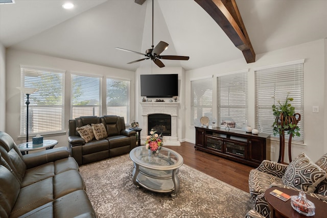 living room with dark wood-type flooring, ceiling fan, and lofted ceiling with beams