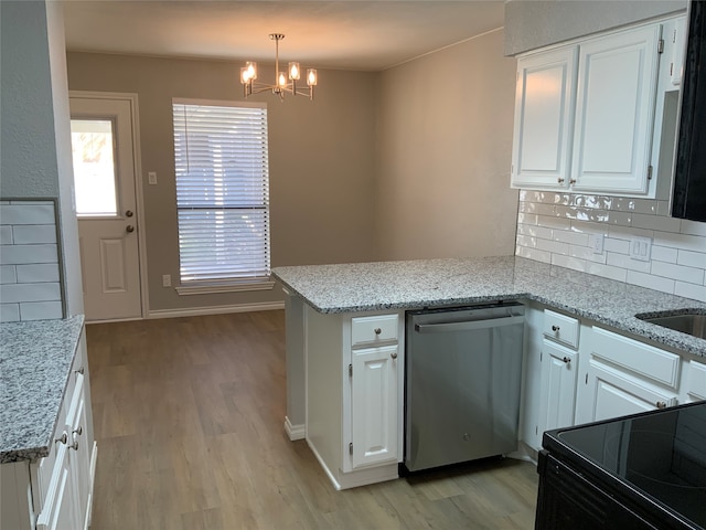 kitchen featuring light hardwood / wood-style flooring, hanging light fixtures, electric range, stainless steel dishwasher, and white cabinetry