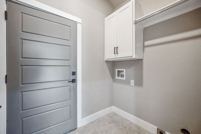 laundry area with cabinets and hookup for a washing machine