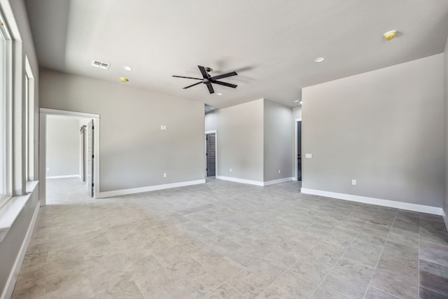 unfurnished room with ceiling fan