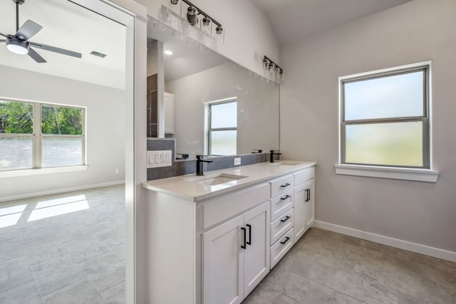 bathroom with vanity, tile patterned floors, lofted ceiling, and ceiling fan