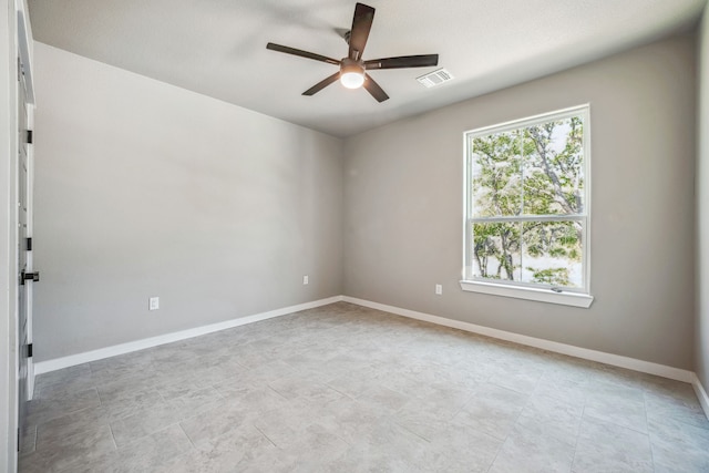 unfurnished room with ceiling fan