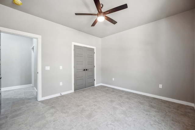 unfurnished bedroom with a closet and ceiling fan