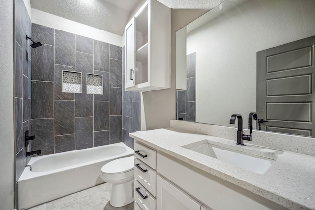 full bathroom with vanity, tiled shower / bath combo, toilet, and tile patterned floors