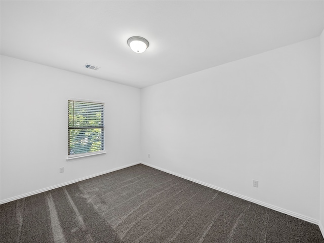 unfurnished room with carpet floors