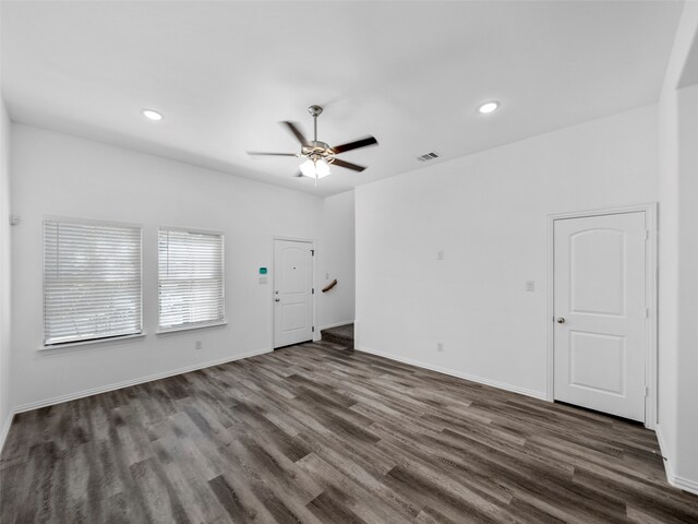 interior space with ceiling fan and dark hardwood / wood-style floors