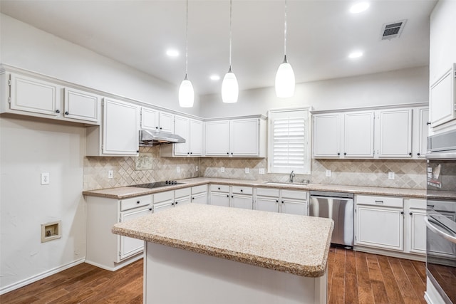 kitchen with white cabinetry, stainless steel appliances, hanging light fixtures, and a kitchen island