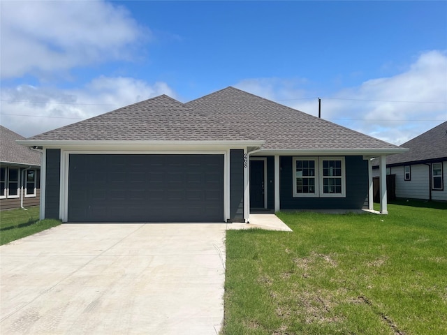 268 Sunnyside Dr, Trenton, TX 75490 - view of front facade featuring a garage, concrete driveway, a front lawn, and roof with shingles