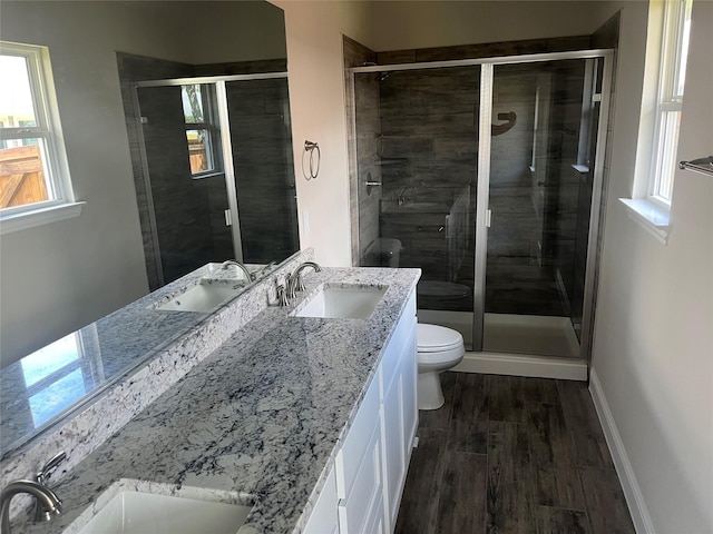 268 Sunnyside Dr, Trenton, TX 75490 - bathroom featuring toilet, vanity, a stall shower, and wood finished floors