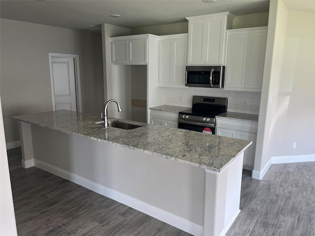 268 Sunnyside Dr, Trenton, TX 75490 - kitchen with stainless steel appliances, a sink, and white cabinets
