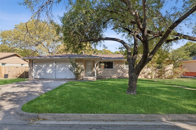 ranch-style house featuring a front lawn and a garage