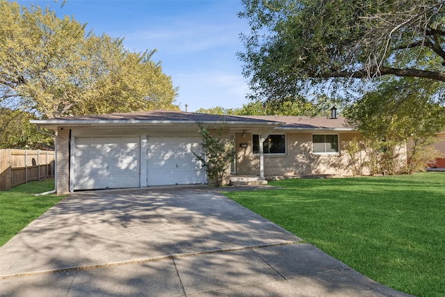 single story home featuring a front yard and a garage