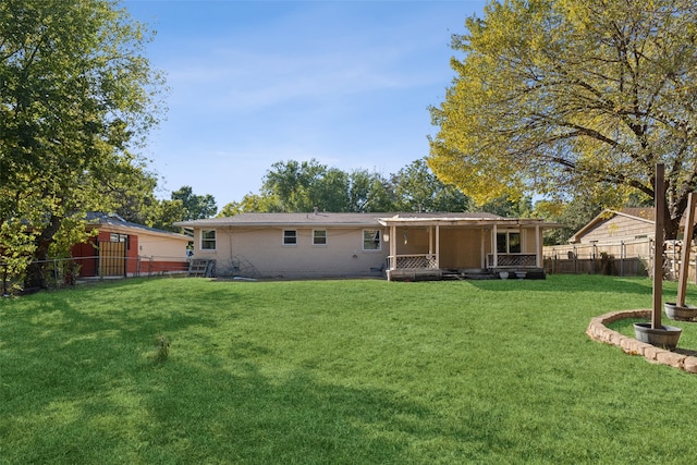 back of house with a yard