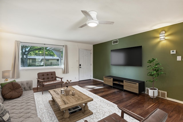 living room with ceiling fan and dark hardwood / wood-style flooring