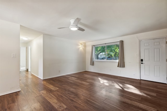 unfurnished room with dark hardwood / wood-style floors and ceiling fan