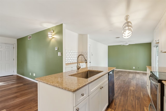 kitchen featuring dishwasher, dark wood-type flooring, a center island with sink, sink, and white cabinets