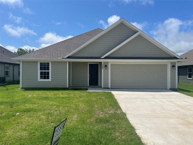 269 Sunnyside Dr, Trenton, TX 75490 - view of front of property featuring a garage, concrete driveway, a front lawn, roof with shingles, and central air condition unit