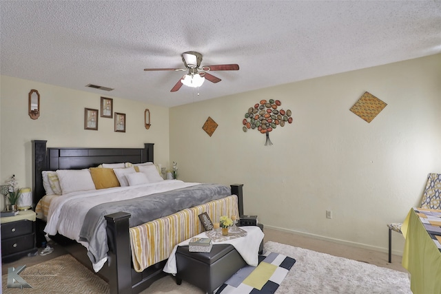 bedroom with light carpet, a textured ceiling, and ceiling fan