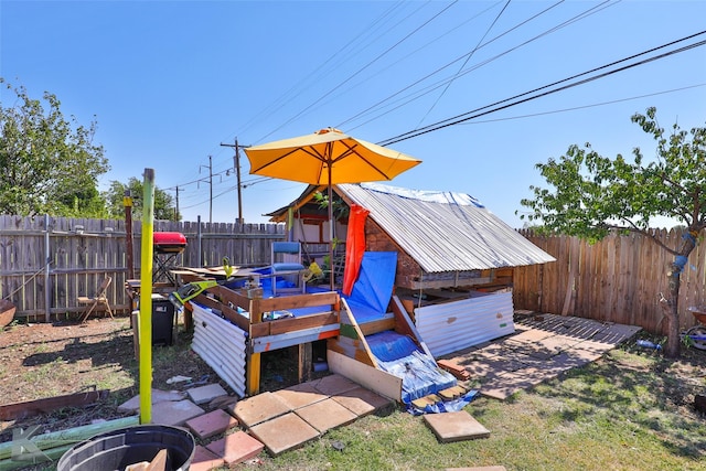 exterior space featuring a shed