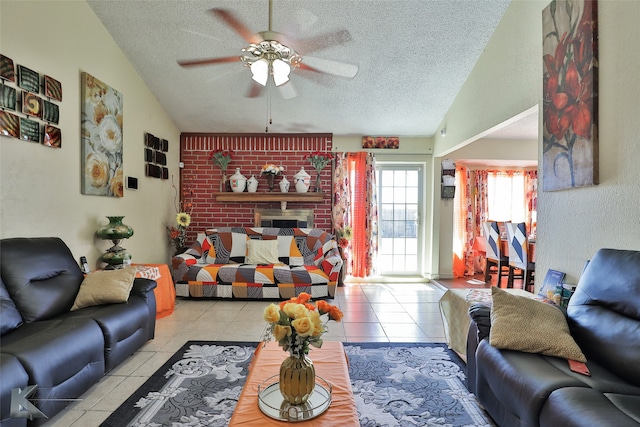 tiled living room featuring a textured ceiling, ceiling fan, and vaulted ceiling