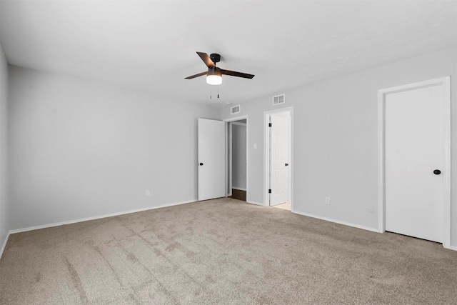 unfurnished bedroom featuring carpet flooring, baseboards, and a ceiling fan